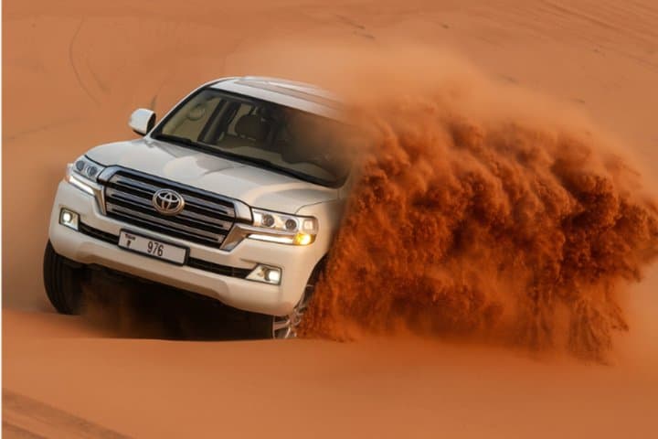 Dubai Desert Safari with Dune Bashing, Camel Ride & BBQ Dinner